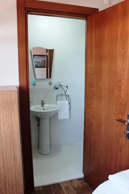 a bathroom with a sink and a mirror at Kadikoy Otel in Istanbul