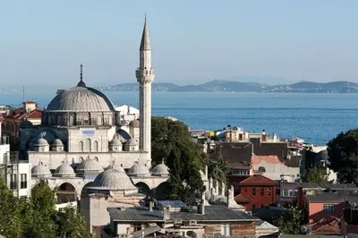 a view of a city with a mosque and the ocean at Aslan Apartments in Istanbul