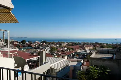 a view of a city with buildings and the ocean at Aslan Apartments in Istanbul