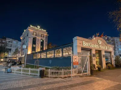 a building with a restaurant in front of it at night at BEST GARDEN HOTEL in Istanbul