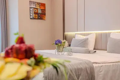 a hotel room with a bed with a vase of flowers at BEST GARDEN HOTEL in Istanbul