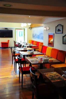 a row of tables and chairs in a restaurant at Feronya Hotel in Istanbul