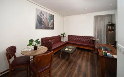 a waiting room with a couch and a table at Taksim Mood in Istanbul