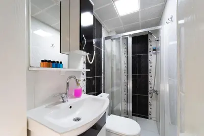 a bathroom with a sink and a toilet and a shower at Taksim Mood in Istanbul