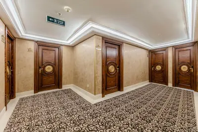an empty room with wooden doors and a carpet at Eurostar Old City Hotel & Spa in Istanbul