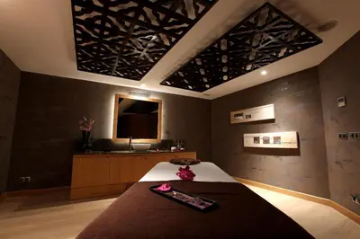 a bedroom with a bed with a black wall at Miracle Istanbul Asia Airport Hotel & Spa in Istanbul