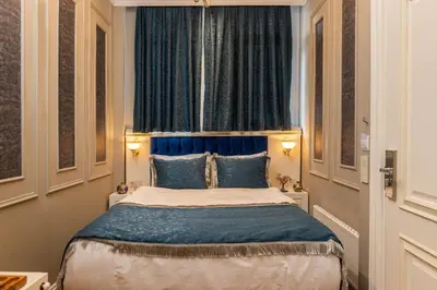 a bedroom with a large bed with a window at Begonville 2 Mansion Oldcity in Istanbul