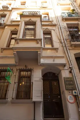 a tall building with windows and a door at Chambers of the Boheme in Istanbul