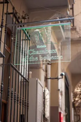a sign for a store on the side of a building at Chambers of the Boheme in Istanbul