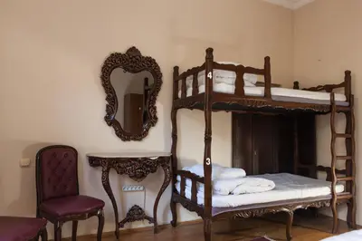 a bedroom with two bunk beds and a mirror at Chambers of the Boheme in Istanbul