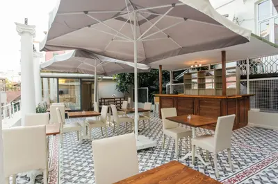 a restaurant with tables and chairs and an umbrella at The Loft Istanbul in Istanbul