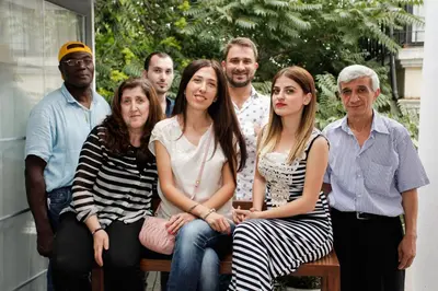 a group of people sitting on a bench at The Loft Istanbul in Istanbul