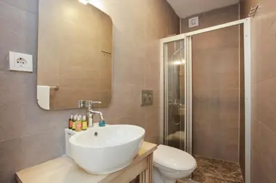 a bathroom with a sink and a toilet and a shower at The Loft Istanbul in Istanbul