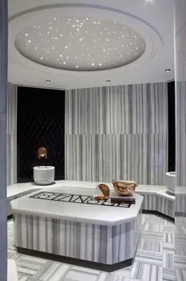 a living room with a table and a ceiling at Victory Hotel & Spa Istanbul in Istanbul