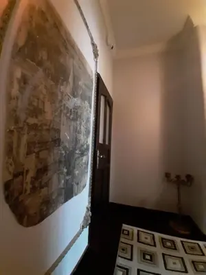 a hallway with a large painting on the wall at Fener sweet in Istanbul