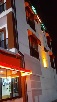 a building with a sign on the side of it at WİND HOTEL in Sakarya