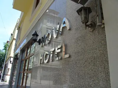 a hotel sign on the side of a building at Hotel Nova in Istanbul