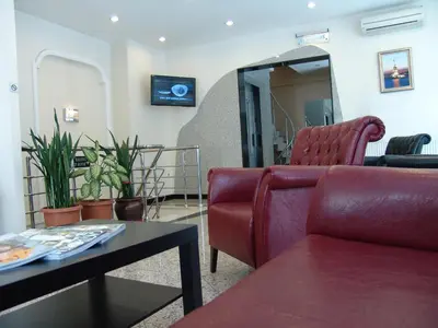 a living room with a couch and a table at Hotel Nova in Istanbul