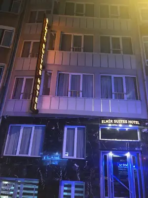 a building with a sign that reads elkin suites hotel at ELMİR SUİTES Hotel in Istanbul
