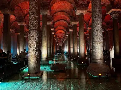 a long hallway with columns in a building at ELMİR SUİTES Hotel in Istanbul