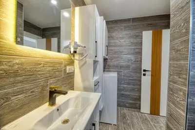 a bathroom with a sink and a mirror at Grisverde Suites in Istanbul