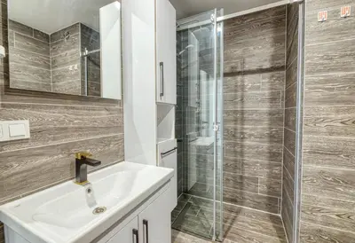 a bathroom with a sink and a shower at Grisverde Suites in Istanbul
