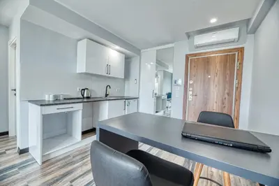 a kitchen with a long table and chairs at Grisverde Suites in Istanbul
