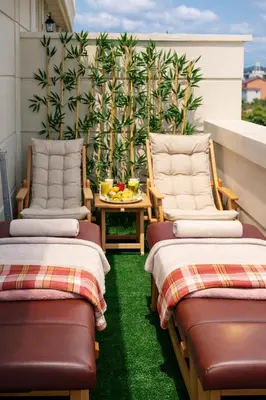 two chairs and a table on a balcony at Emirtimes Hotel&Spa - Tuzla in Istanbul