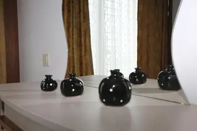 a group of black vases sitting on a table at TEVETOGLU HOTEL in Istanbul
