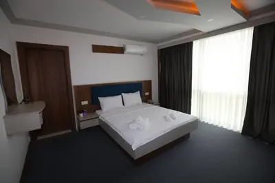 a hotel room with a bed and a window at TEVETOGLU HOTEL in Istanbul