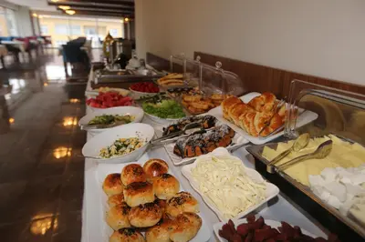 a buffet line with different types of pastries and other foods at TEVETOGLU HOTEL in Istanbul