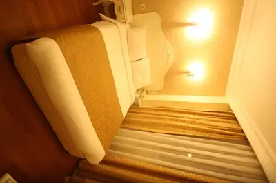a stairwell in a hotel room with a roll of towels at Sirkeci Park Hotel in Istanbul