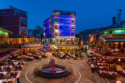 a city with a fountain in the middle of a street at Golden Sand Hotel in Istanbul