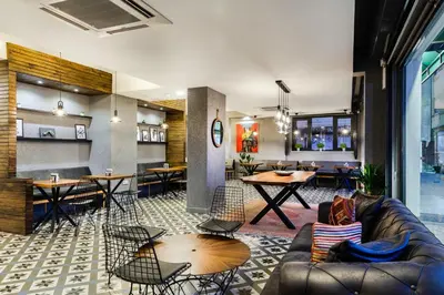 a lobby with a couch and tables and chairs at DORUK PALAS HOTEL in Istanbul