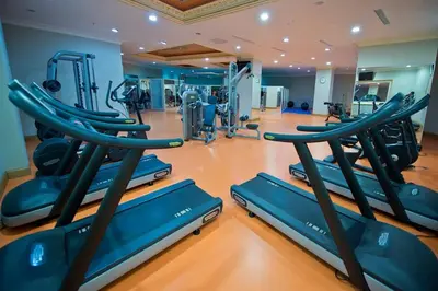a gym with several treadmills and elliptical machines at The Sign Kocaeli Thermal Spa Hotel &Convention Center in Yeniköy