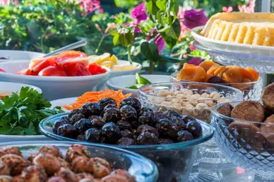a table topped with bowls of fruit and other foods at Darussaade Hotel Old City - Sultanahmet in Istanbul