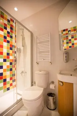 a bathroom with a toilet and a shower at Cityloft 36 in Istanbul
