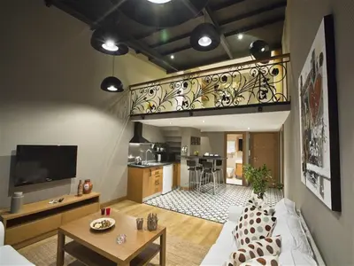 a living room with a white couch and a kitchen at Cityloft 36 in Istanbul