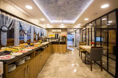 a buffet line in a restaurant with a lot of food at Hotel Bestur in Istanbul