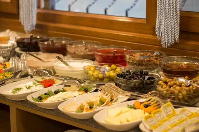 a buffet with many different types of food on a table at Hotel Bestur in Istanbul