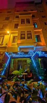 a building with a blue sign in front of it at taksim diamond hotel in Istanbul