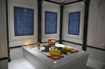 a room with a bath tub with blue windows at Seven Hills Palace & Spa in Istanbul