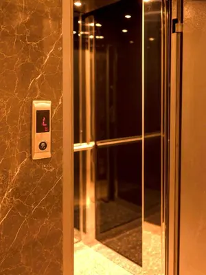 a bathroom with a walk in shower next to a glass door at THE LAİLA HOTEL in Istanbul