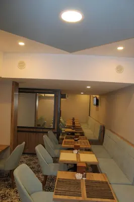 a row of tables and chairs in a restaurant at THE LAİLA HOTEL in Istanbul