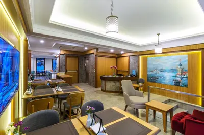 a restaurant with tables and chairs and a bar at Obelisk Hotel & Suites in Istanbul