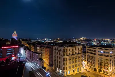 a view of a city at night at Galata Times Hotel in Istanbul