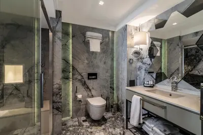 a bathroom with a sink and a toilet and a shower at Galata Times Hotel in Istanbul