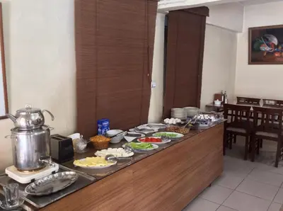 a buffet line with plates of food on it at Elite Hotel City Center Saray Bed and Breakfast in Saray