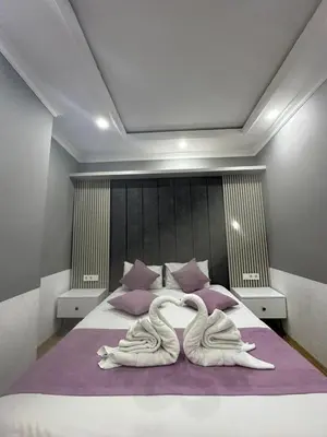 two swans made out of towels on a bed at The Zanadu İstanbul in Istanbul