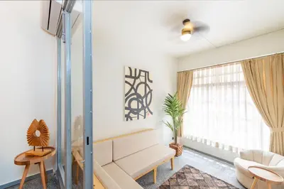a living room with a couch and a chair at Mayer Tatarbey Apartments in Istanbul